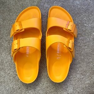 Birkenstocks orange plastic ones
size 38 or women’s 7-7.5